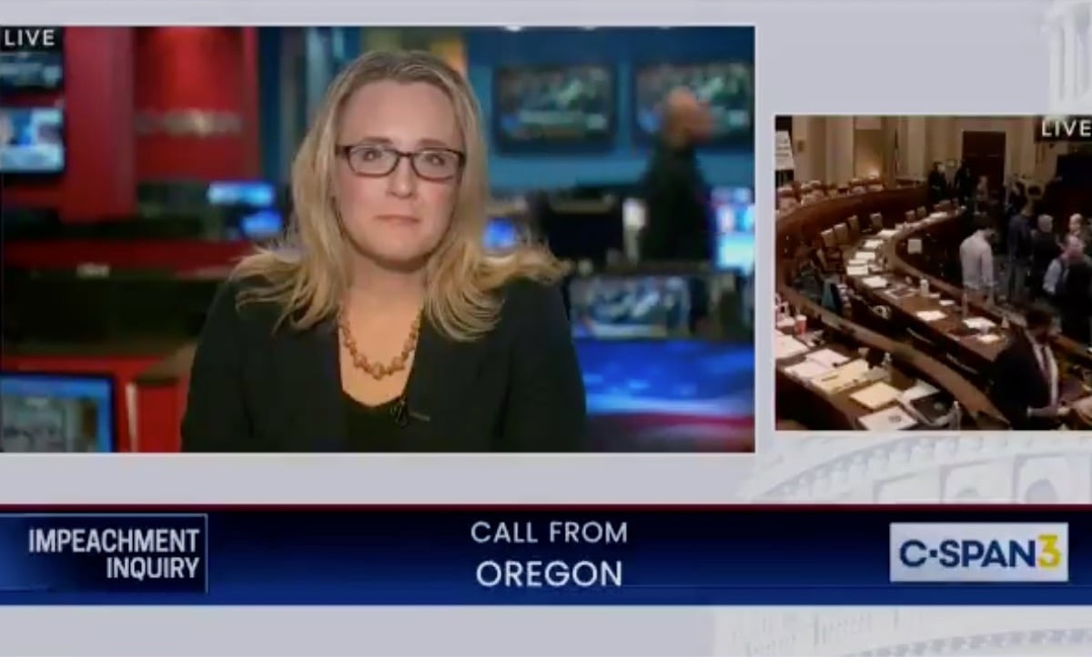 A blonde female C-SPAN host keeps a mostly straight face as an unseen caller rants.