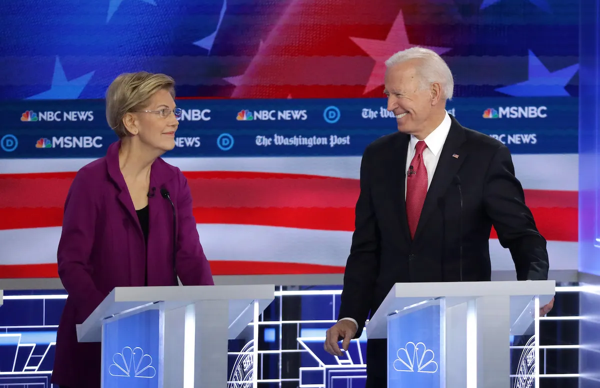 Elizabeth Warren (D-MA) and former Vice President Joe Biden look at each other during the Democratic Presidential Debate