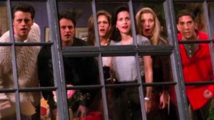 The cast of the show Friends looking out their apartment window.