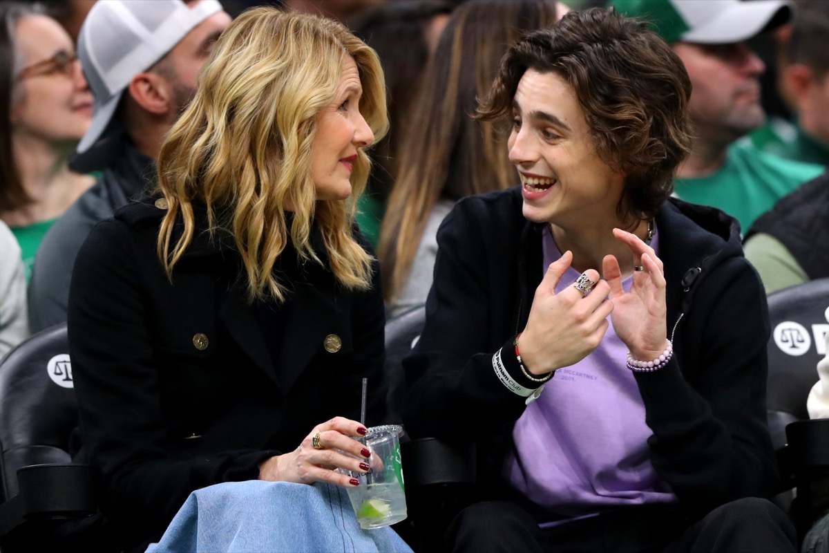 Actress Laura Dern and actor Timothée Chalamet sit courtside during the second half of the game between the Boston Celtics and the Miami Heat at TD Garden on December 04, 2019 in Boston, Massachusetts.