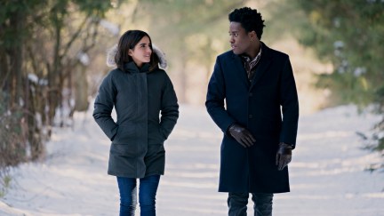 Isabela Merced, Shameik Moore walk together through the snow in Netflix's Let It Snow.