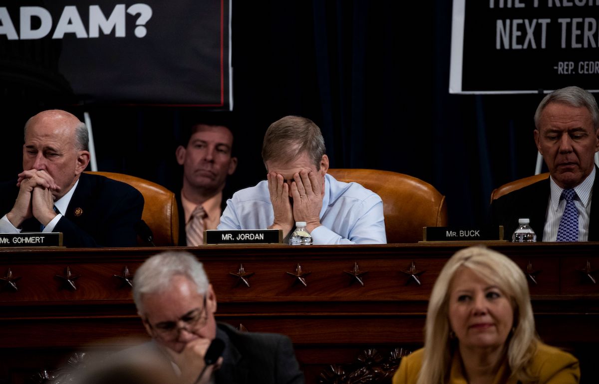 Rep. Jim Jordan (R-OH) puts his face in his hands during a public impeachment inquiry hearing