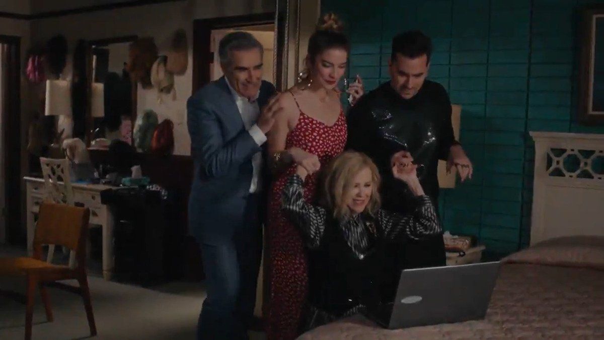 the rose family gathers around laptop