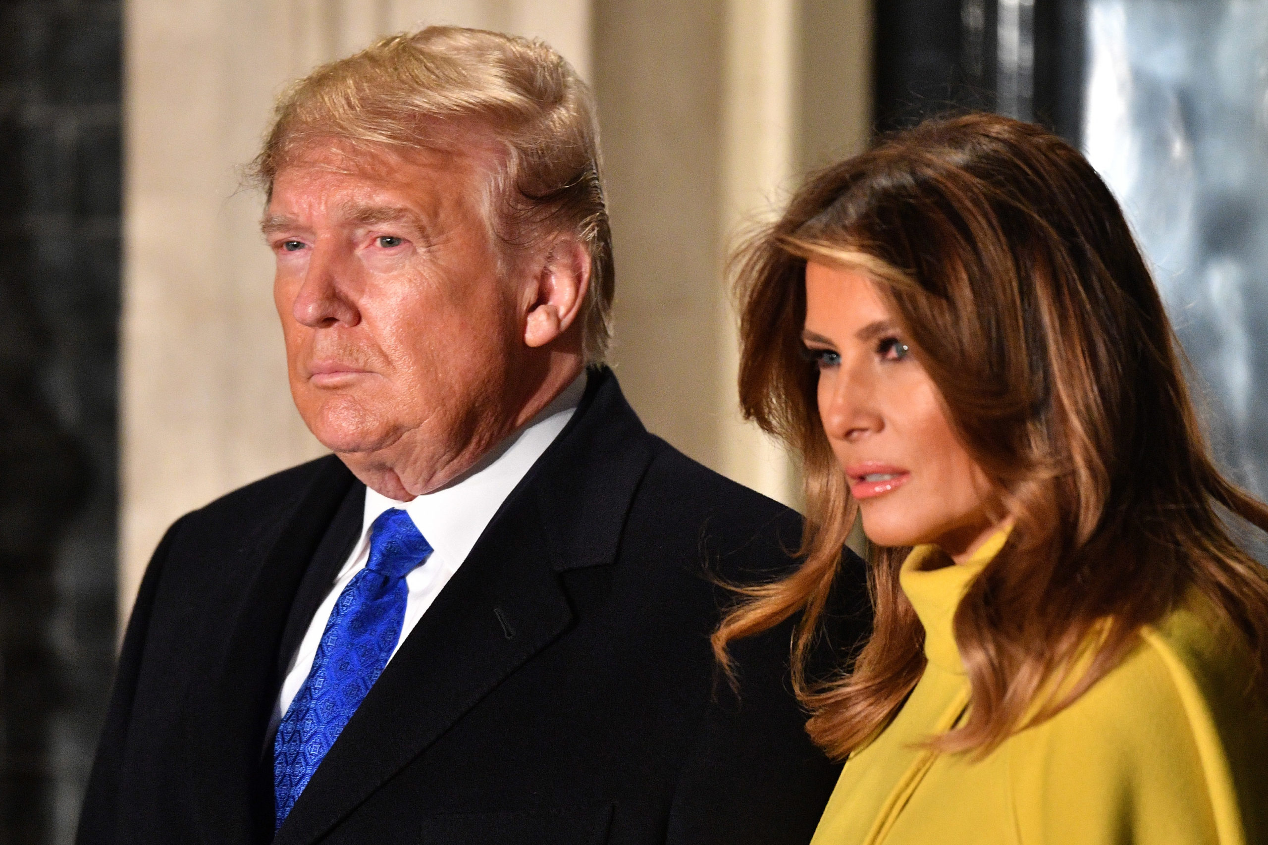 Donald and Melania Trump look very serious.