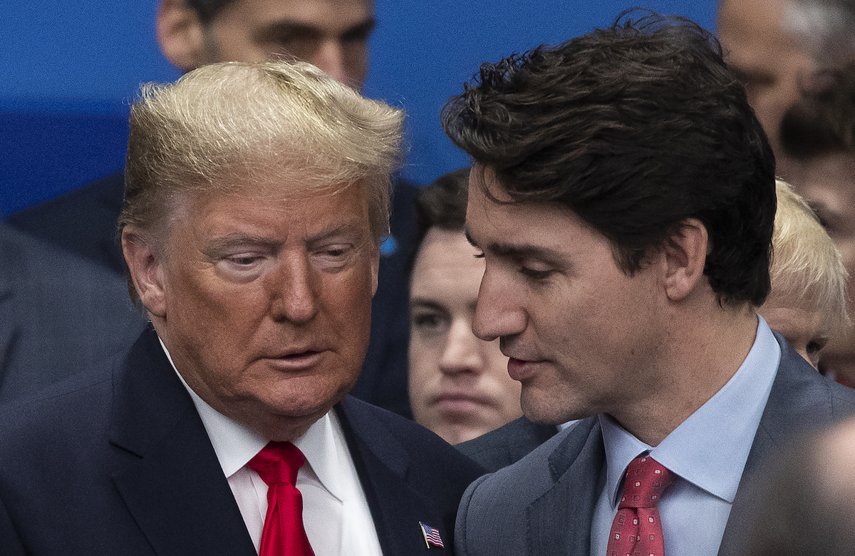 Justin Trudeau whispers something to Donald Trump at the NATO summit in London.