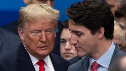 Justin Trudeau whispers something to Donald Trump at the NATO summit in London.