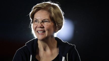 Elizabeth Warren smiles from the stage at a campaign event.