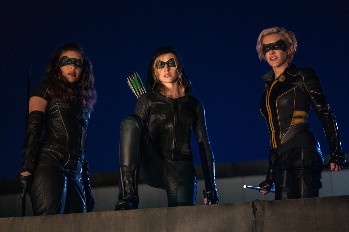 Arrow -- "Green Arrow & The Canaries" -- Image Number: AR809b_0627r.jpg -- Pictured (L-R): Juliana Harkavy as Dinah Drake/Black Canary, Katherine McNamara as Mia and Katie Cassidy as Laurel Lance/Black Siren -- Photo: Colin Bentley/The CW -- © 2020 The CW Network, LLC. All Rights Reserved.