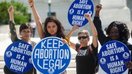 Abortion rights activists rally in front of the US Supreme Court
