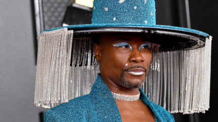 Billy Porter attends the 62nd Annual GRAMMY Awards in a blue jumpsuit and hat with long silver fringe.