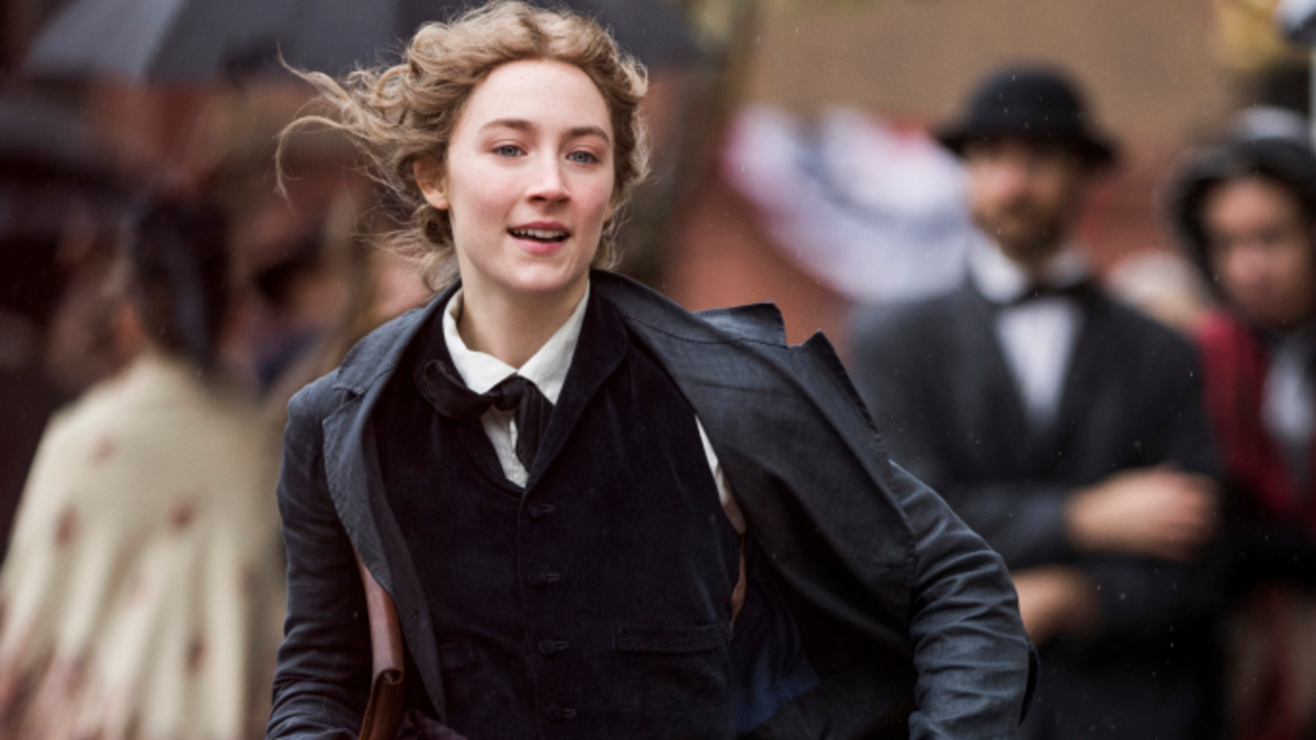 Saoirse Ronan in Greta Gerwig's "Little Women" wearing a uniform and running happily in the street.