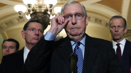 Senate Majority Leader Mitch McConnell (R-KY) (C) talks to reporters