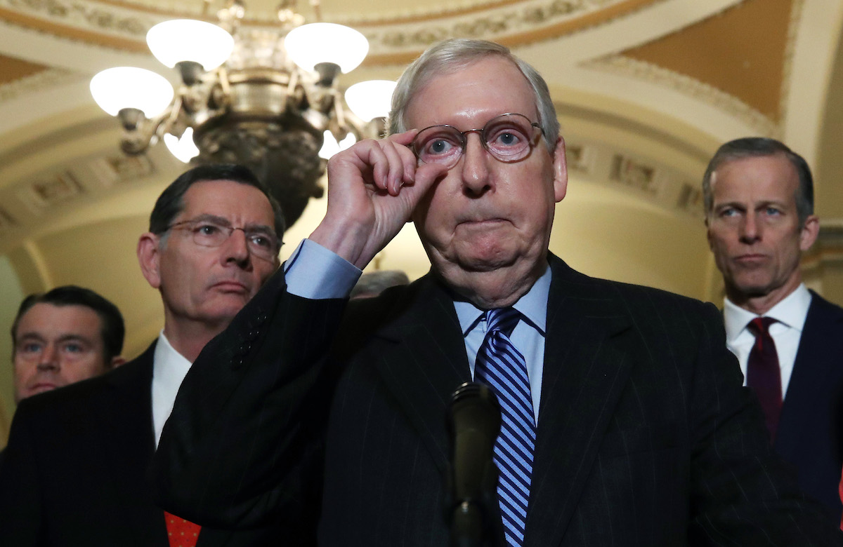 Senate Majority Leader Mitch McConnell (R-KY) (C) talks to reporters