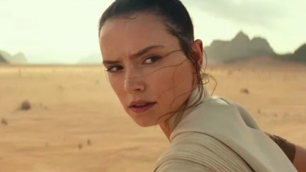 Rey looks over her shoulder in Star Wars: The Rise of Skywalker.