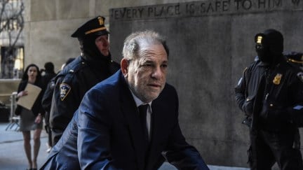 Harvey Weinstein arrives at New York City criminal court, hunched over a walker.