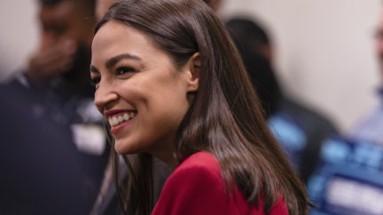 Rep. Alexandria Ocasio-Cortez (D-NY) smiles during a press conference