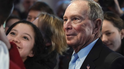 Mike Bloomberg takes a selfie after speaking to supporters at a rally