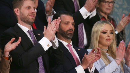 Eric Trump (L), Donald Trump Jr, and Tiffany Trump clap during the State of the Union address