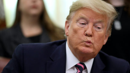 Donald Trump purses his lips uncomfortably
