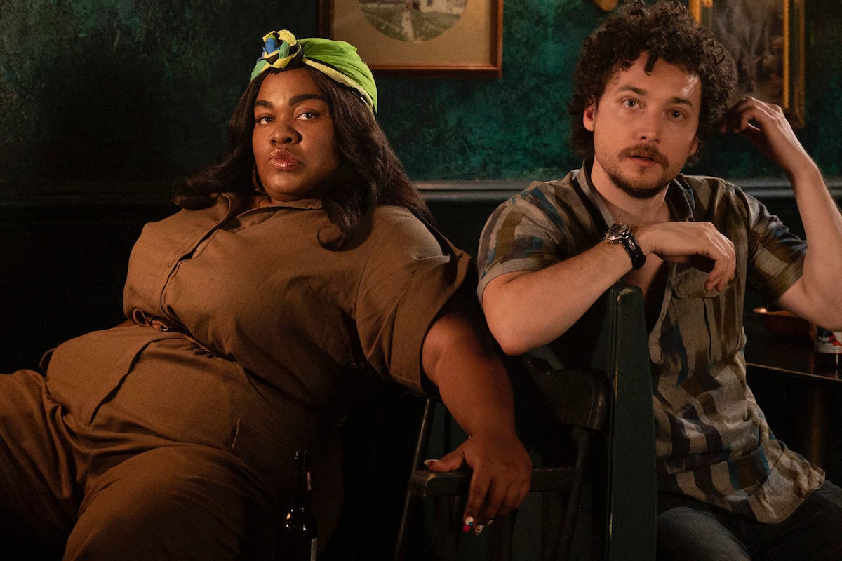 High Fidelity's Cherise (Da'Vine Joy Randolph) and Simon (David H. Holmes) sit side by side, looking at the camera.