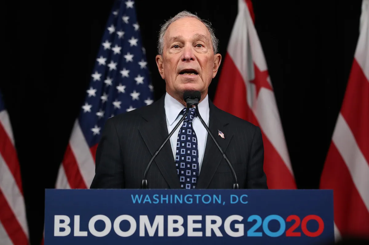 Democratic presidential candidate, former New York City Mayor Michael Bloomberg speaks from a podium.