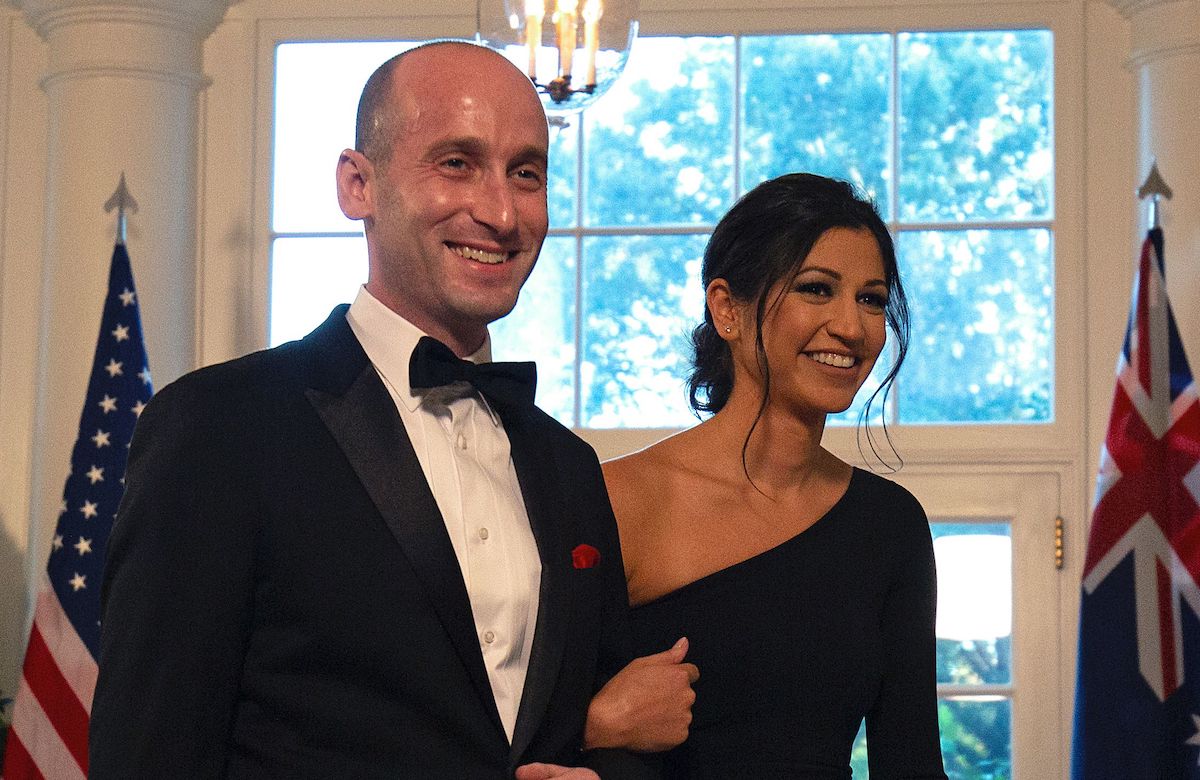 White House Senior Advisor Stephen Miller (L) and Katie Waldman arrive in the Booksellers area of the White House