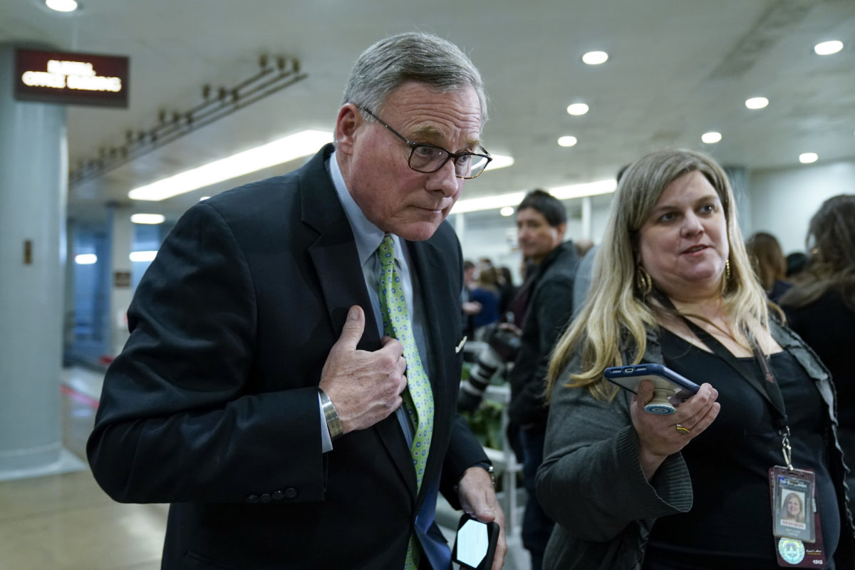 WASHINGTON, DC - JANUARY 23: Sen. Richard Burr (R-NC) speaks with a reporter as he walks through the Senate subway before the impeachment trial of President Donald Trump resumes at the U.S. Capitol on January 23, 2020 in Washington, DC. Democratic House managers will continue their opening arguments on Thursday as the Senate impeachment trial of President Donald Trump continues. (Photo by Drew Angerer/Getty Images)