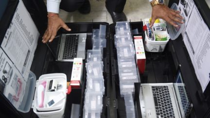 Scientist and founder of Online Telemedicine Research Institute, Ragesh Shah checks the contents of the kits prepared for the coronavirus scanning and surveillance system, in Ahmedabad on March 6, 2020. - India has reported 31 cases of the virus that has killed more than 3,300 people and infected nearly 100,000 worldwide after it emerged in the Chinese city of Wuhan in December. (Photo by SAM PANTHAKY / AFP) (Photo by SAM PANTHAKY/AFP via Getty Images)