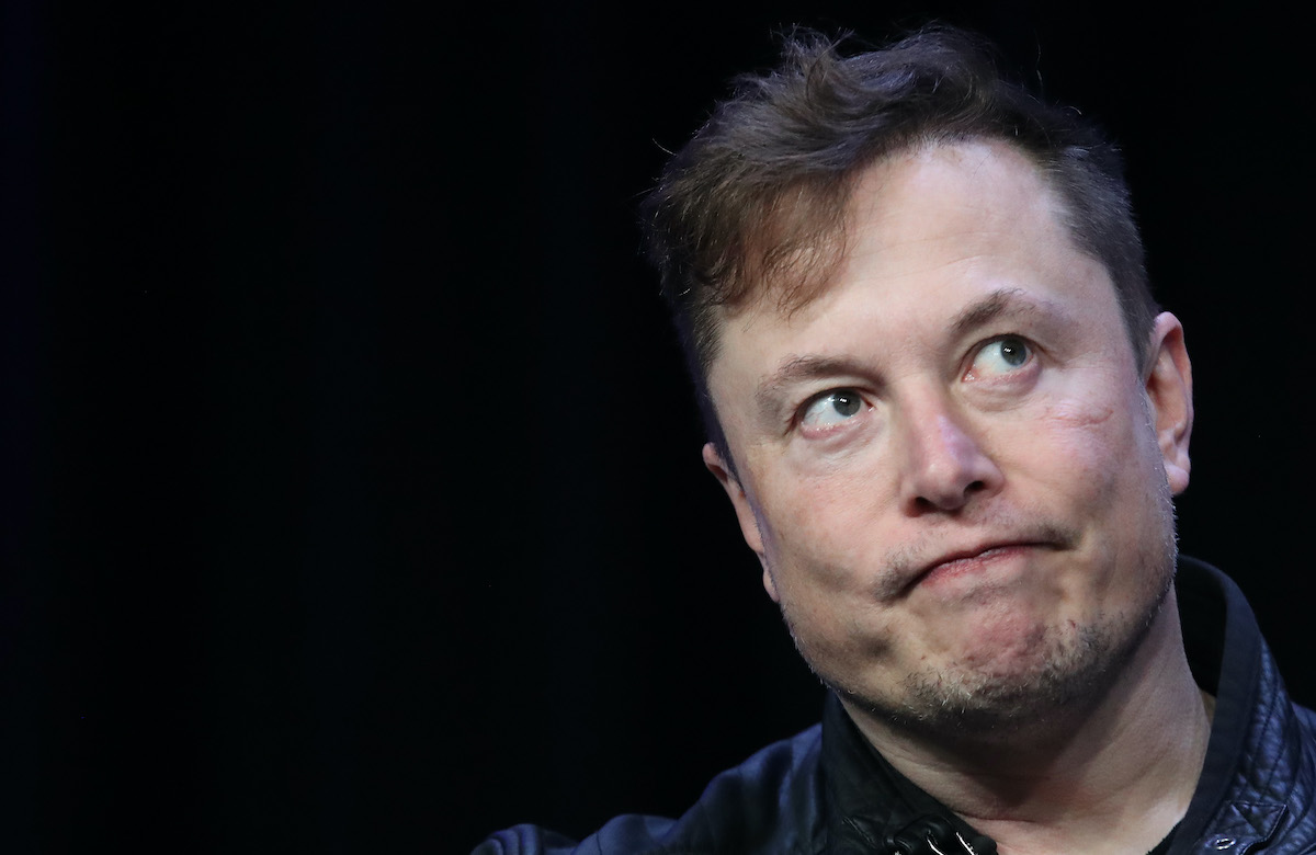 Elon Musk makes a frowny face.