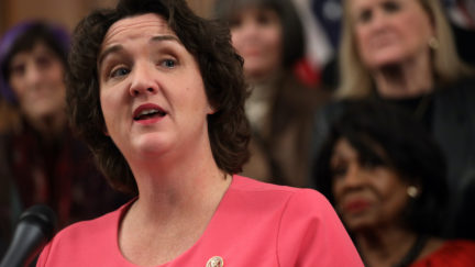 Katie Porter speaks in front of her fellow Congresswomen.