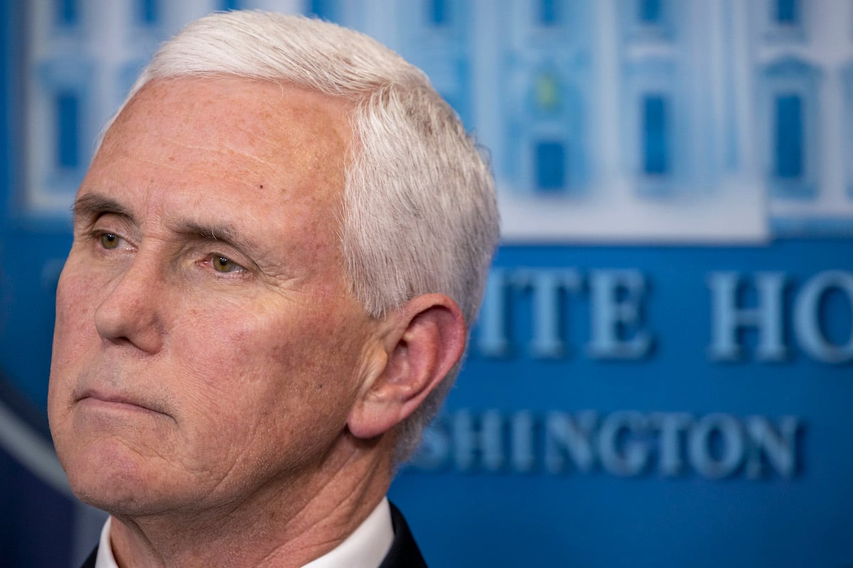 Close up on Mike Pence's cold dead-eyed face.