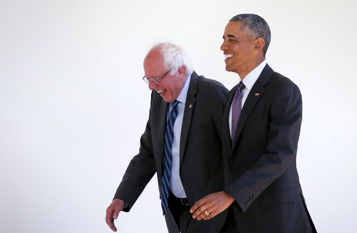 Bernie Sanders (I-VT) (L) walks with President Barack Obama (R) through the Colonnade as he arrives at the White House for an Oval Office meeting