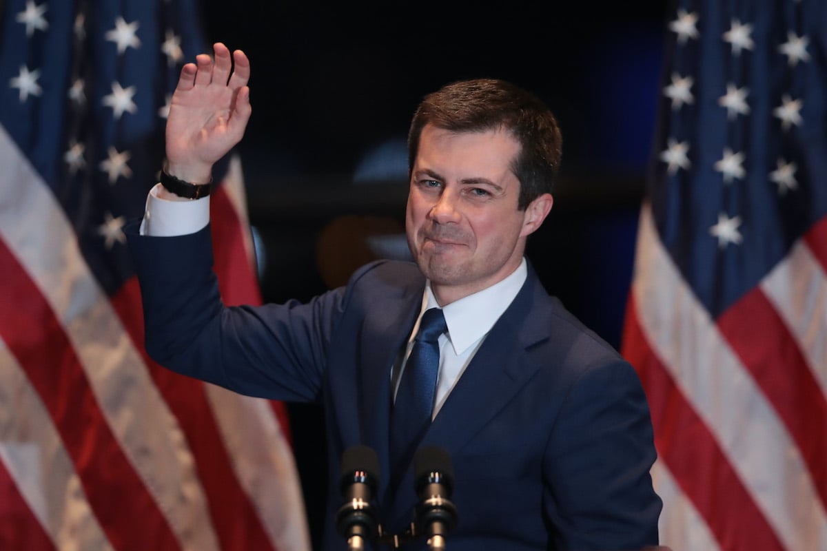 Pete Buttigieg waves goodbye from a campaign event.