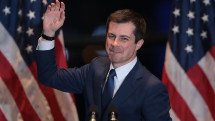 Pete Buttigieg waves goodbye from a campaign event.