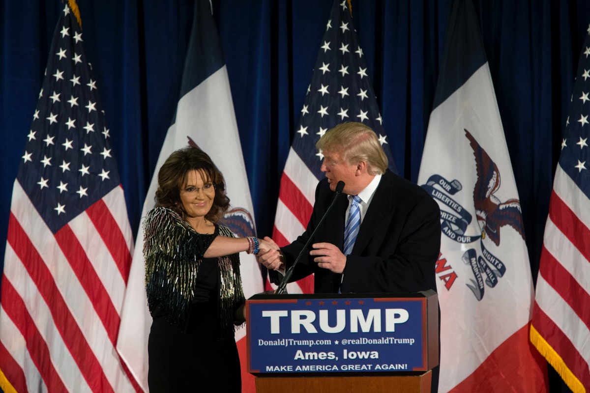 Republican presidential candidate Donald Trump shakes hands with former Alaska Gov. Sarah Palin at Hansen Agriculture Student Learning Center at Iowa State University on January 19, 2016 in Ames, IA. Trump received Palin's endorsement at the event. (Photo by Aaron P. Bernstein/Getty Images)