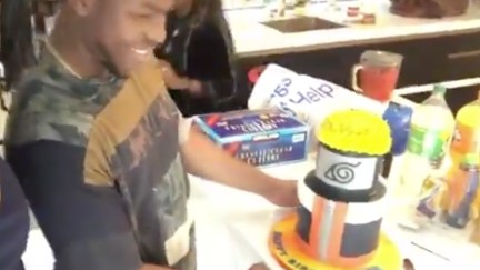 John Boyega, a Pisces icon, celebrating his birthday with naruto cake