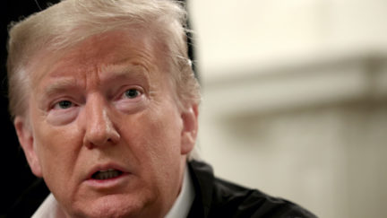 Donald Trump answers questions after signing a bipartisan $8 billion funding bill at the White House