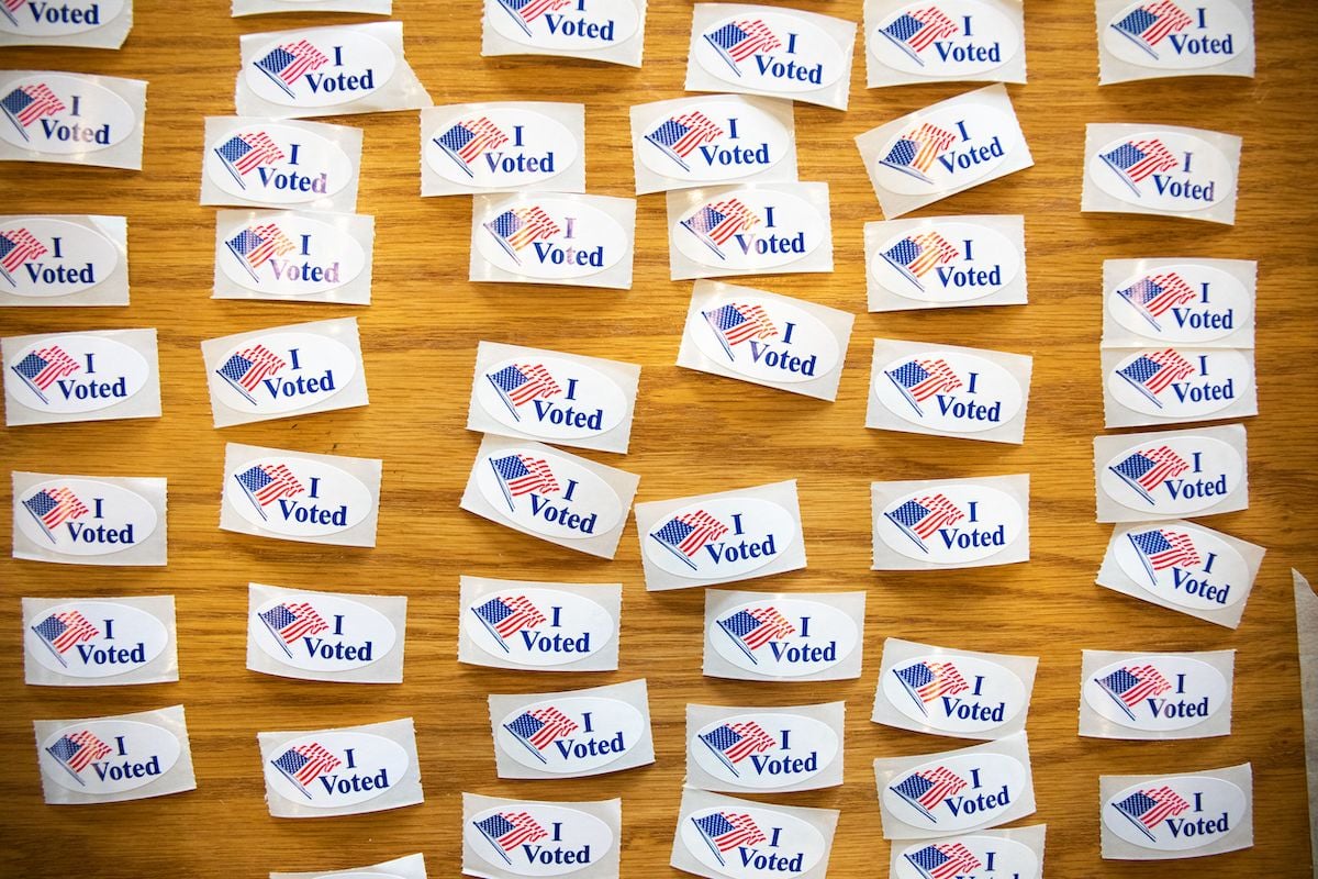 "I Voted" stickers cover a table at a polling station