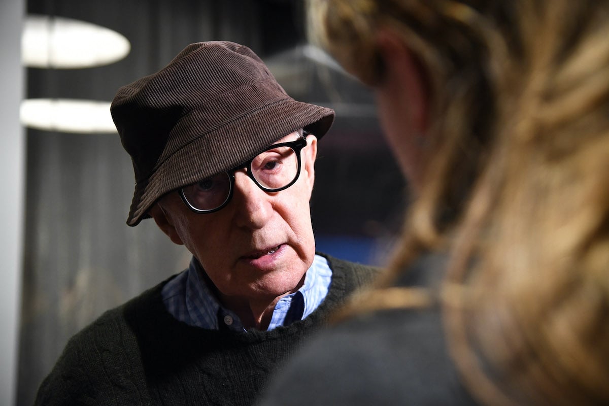 Woody Allen wears a terrible corduroy hat.