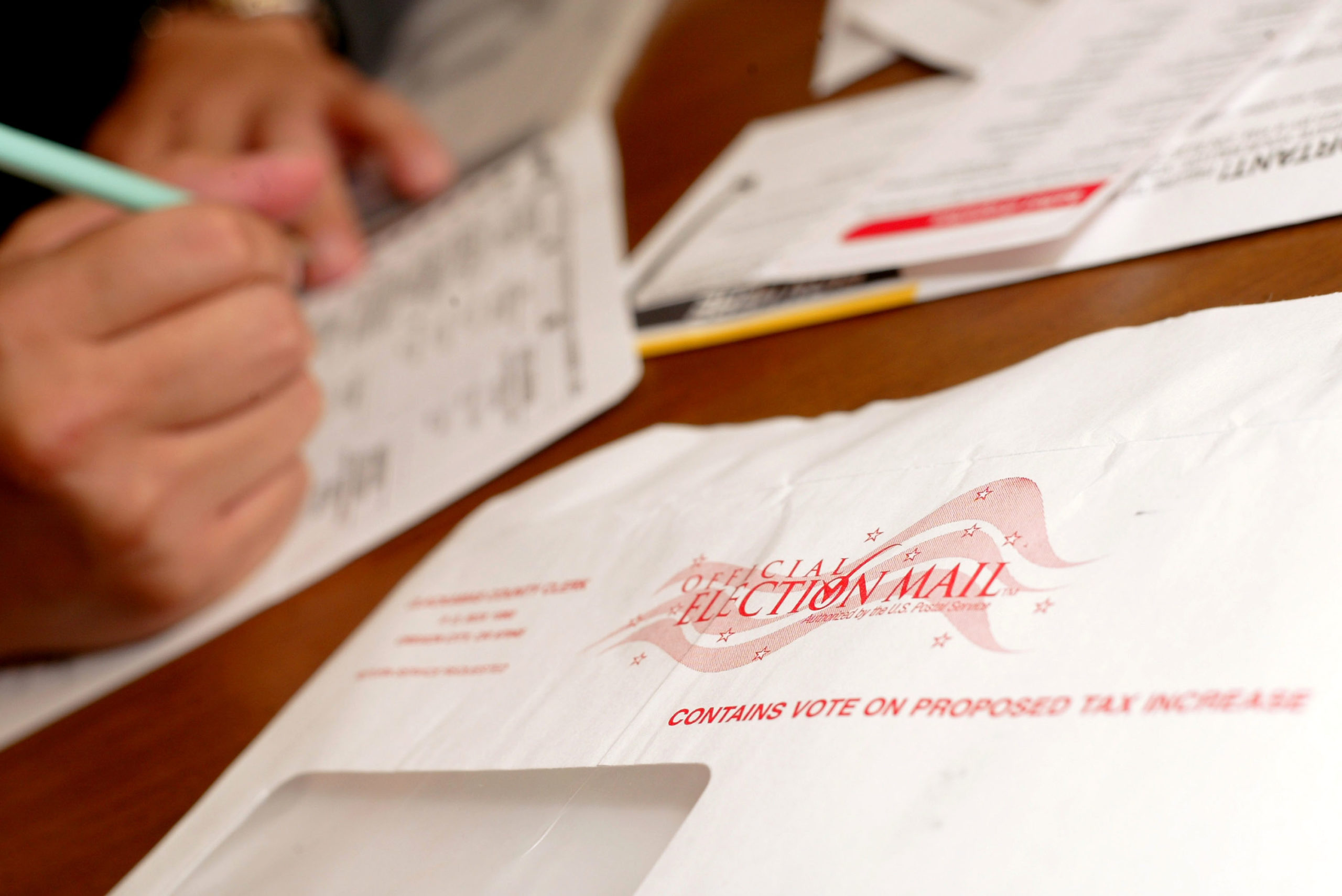 WILSONVILLE, OR - NOVEMBER 1: Jaime Valdez casts a ballot from his home November 1, 2004 in Wilsonville, Oregon. Oregon voters can now vote by mail instead of going to a polling station. (Photo by Craig Mitchelldyer/Getty Images)