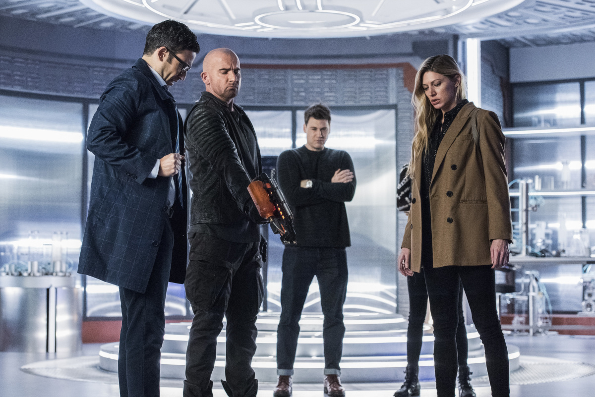 Legends of Tomorrow -- "The Great British Fake Off" -- Image Number: LGN510b_0421b.jpg -- Pictured (L-R): Adam Tsekhman as Agent Gary Green,  Dominic Purcell as Mick Rory/Heatwave, Nick Zano as Nate Heywood/Steel and Jes Macallan as Ava Sharpe -- Photo: Dean Buscher/The CW -- © 2020 The CW Network, LLC. All Rights Reserved.