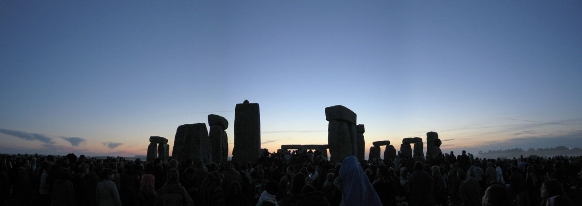 pagans gather before stonehenge on the summer solstice
