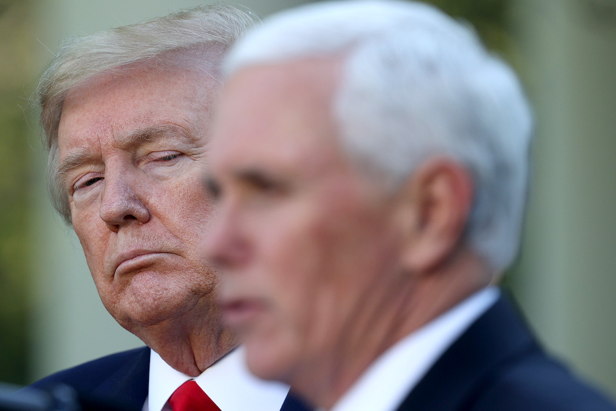 Trump appears to glare at Mike Pence during a White House press briefing.