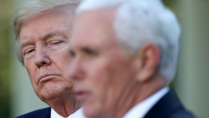 Trump appears to glare at Mike Pence during a White House press briefing.