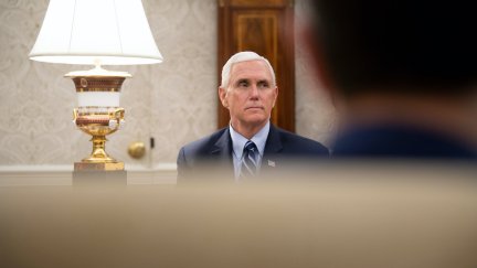 Mike Pence sits in the Oval Office without a face mask.