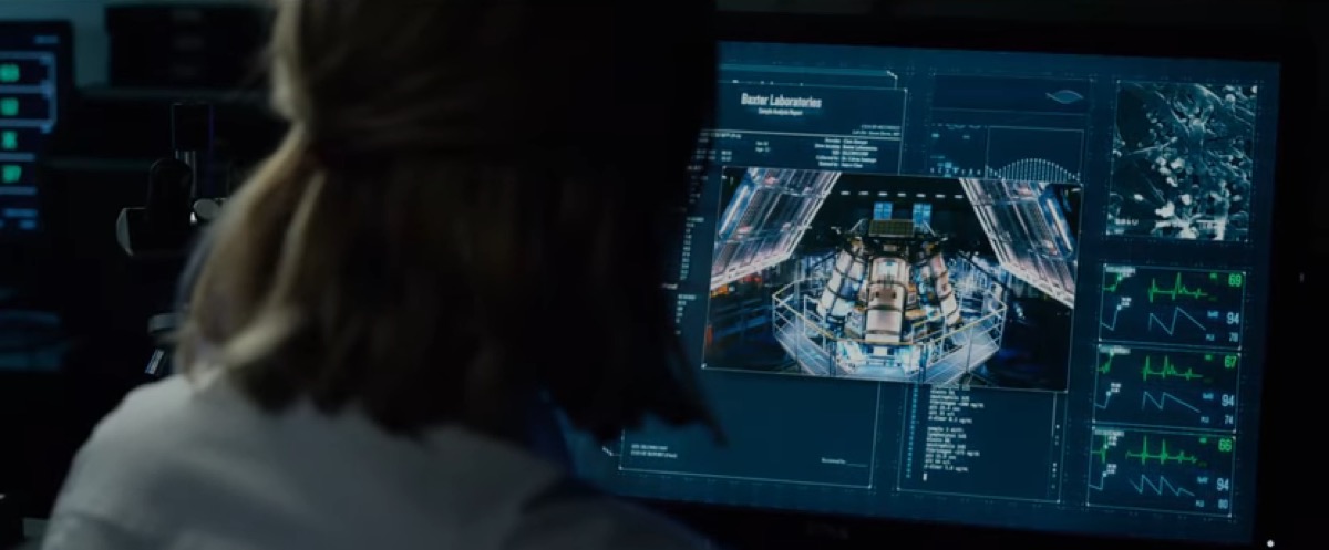 Sue Storm overlooking monitors of equipment.