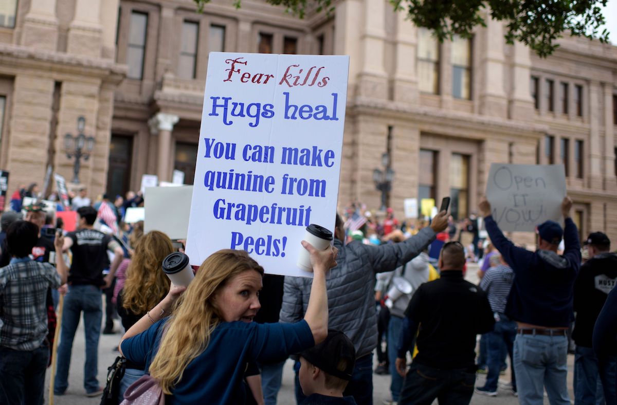 A protester demonstrates during the "Reopen America" rally