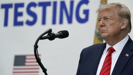 Trump has a pouty face while listening during a press briefing.