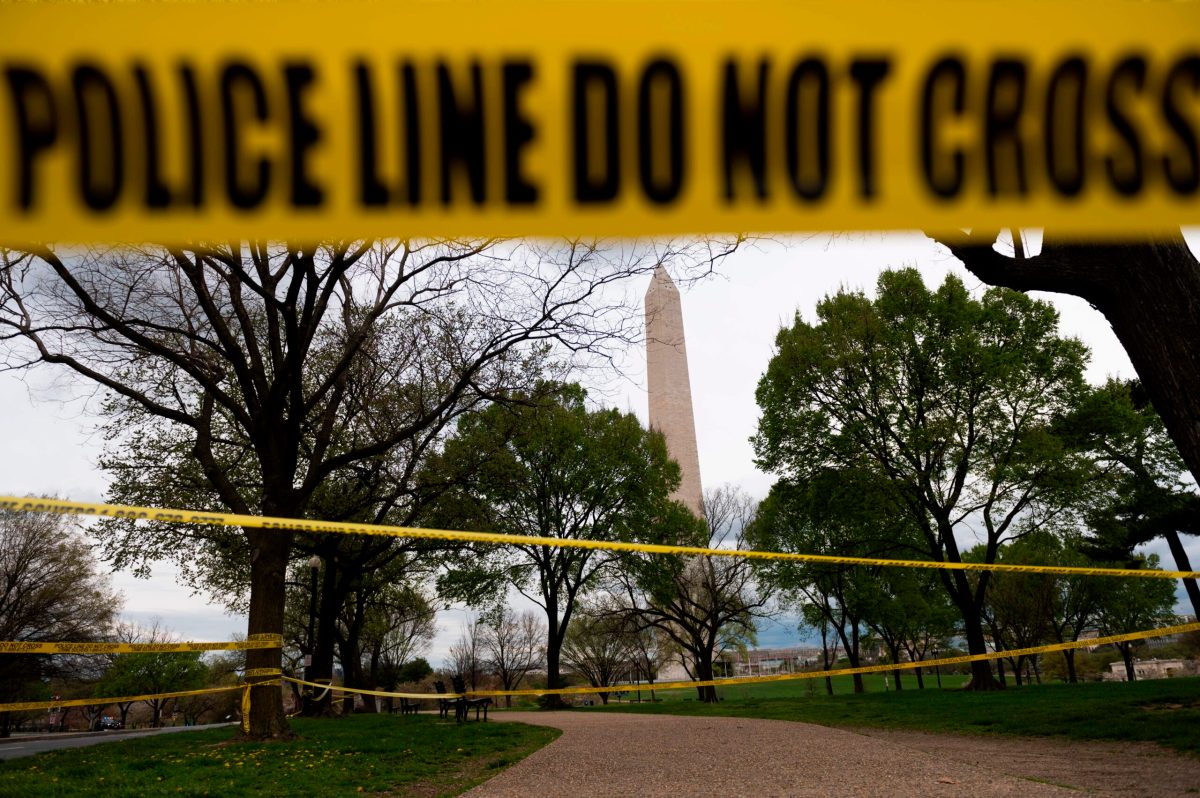 TOPSHOT - Police tape blocks a path leading to the Washington Monument on March 31, 2020, in Washington, DC. - To prevent the spread of coronavirus, COVID-19, , Virginia, Maryland and Washington, DC, all announced March 30 stay-at-home orders, which strongly discourage residents from leaving home, except for essential trips like grocery or pharmacy shopping, or to travel for work. (Photo by ANDREW CABALLERO-REYNOLDS / AFP) (Photo by ANDREW CABALLERO-REYNOLDS/AFP via Getty Images)