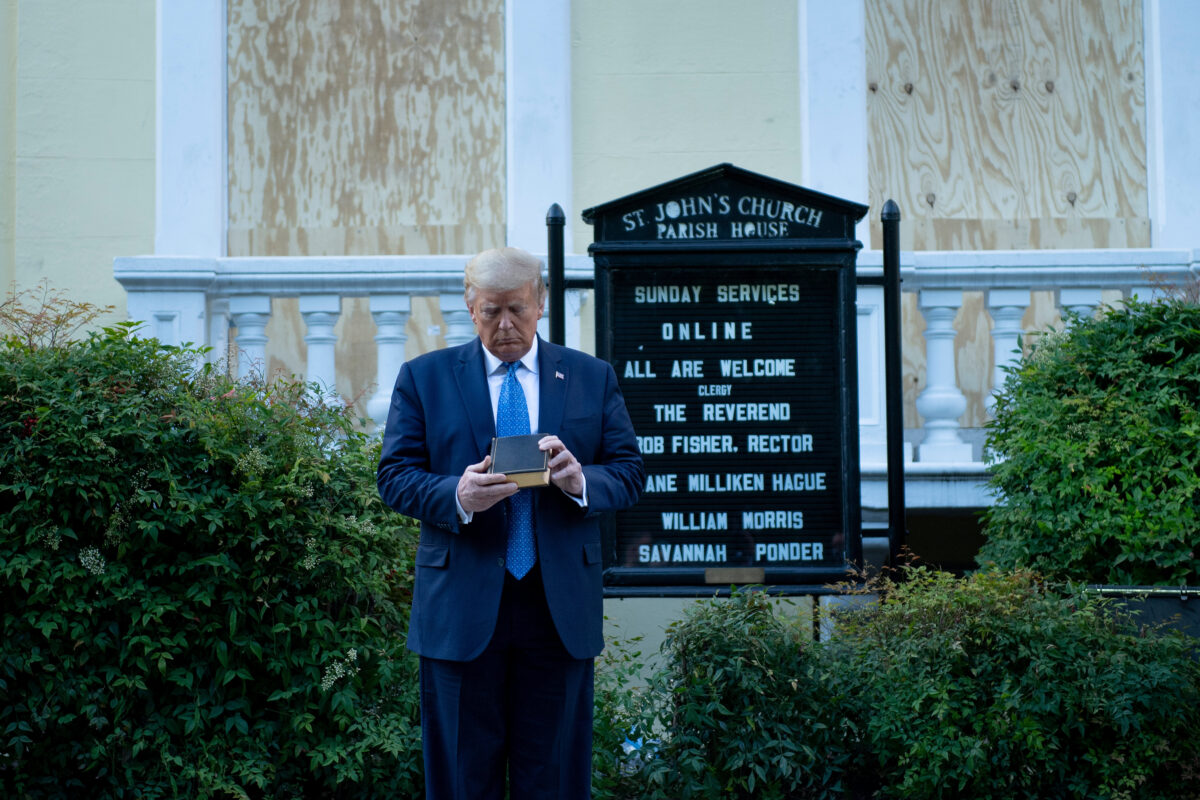 US President Donald Trump holds a Bible while visiting St. John's Church across from the White House after the area was cleared of people protesting the death of George Floyd June 1, 2020, in Washington, DC. - US President Donald Trump was due to make a televised address to the nation on Monday after days of anti-racism protests against police brutality that have erupted into violence. The White House announced that the president would make remarks imminently after he has been criticized for not publicly addressing in the crisis in recent days. (Photo by Brendan Smialowski / AFP) (Photo by BRENDAN SMIALOWSKI/AFP via Getty Images)